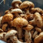 A close-up of a plastic container filled with slimy, wilted