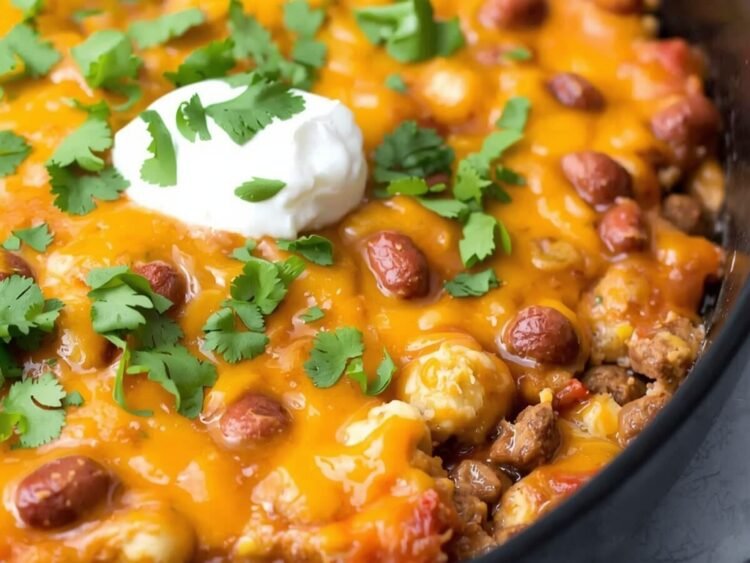 A sizzling casserole dish filled with layers of seasoned taco