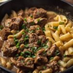 A sizzling skillet of leftover brisket stroganoff, with tender chunks